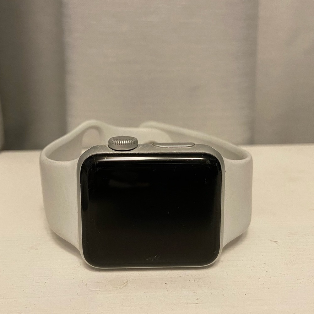 Apple Watch Series 3 with strap + charging cable